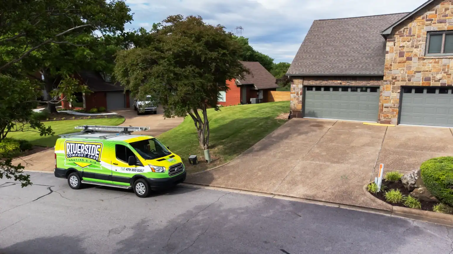 Riverside service van parked in a River Valley neighborhood