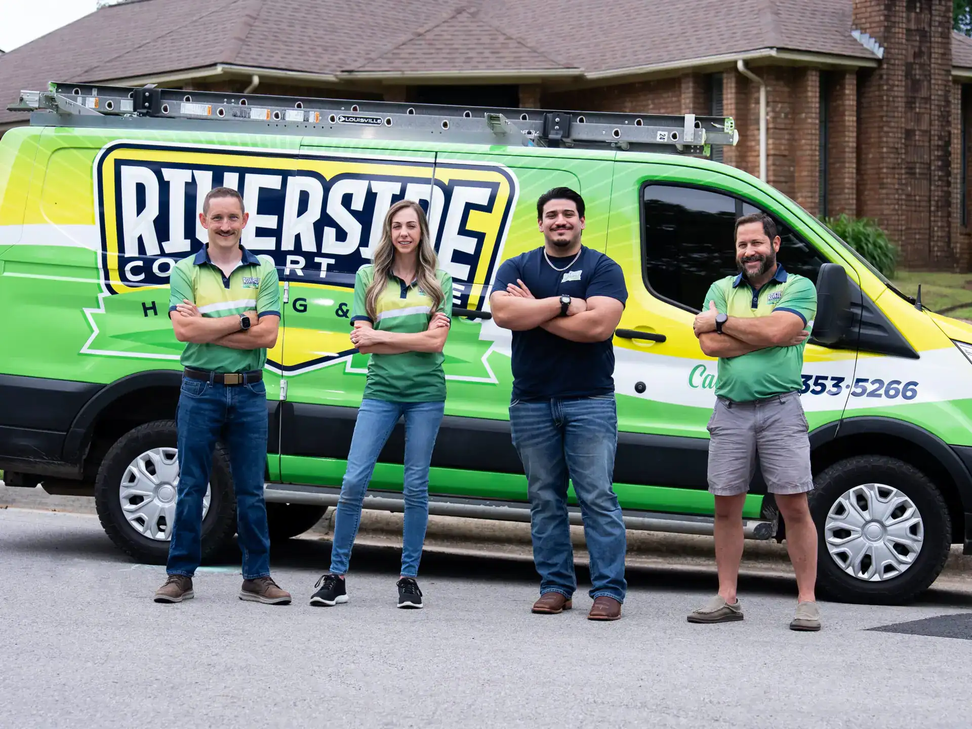Riverside Heating Air Plumbing team in front of a company van