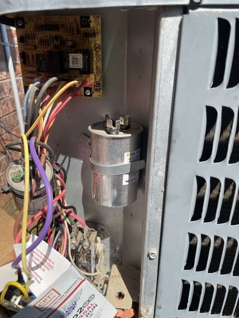 New capacitor mounted in the control panel of an outdoor AC unit in Dyer, Arkansas