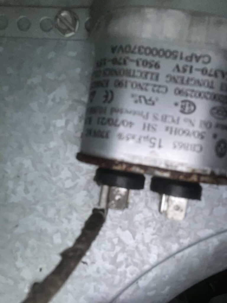Worn capacitor inside an outdoor AC unit in Dyer, Arkansas