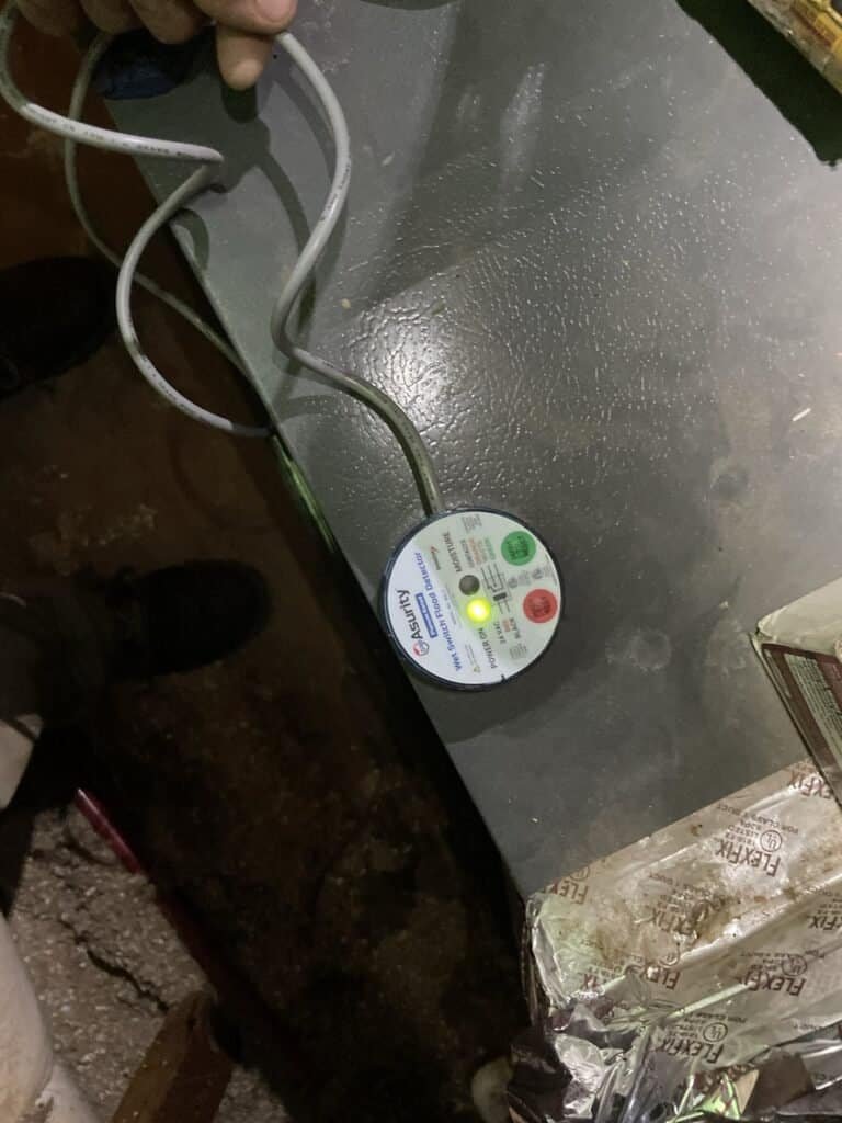 Condensate safety switch installed in the drain pan of a Fort Smith HVAC system