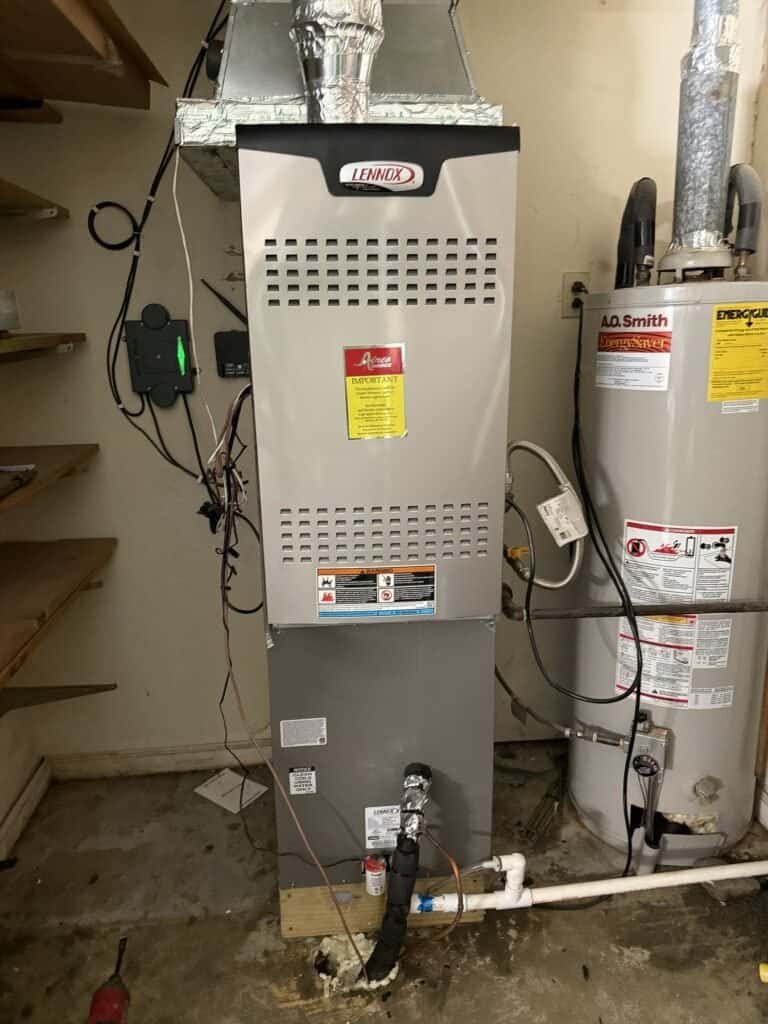 Gas furnace with the evaporator coil cabinet on top in a Fort Smith utility closet