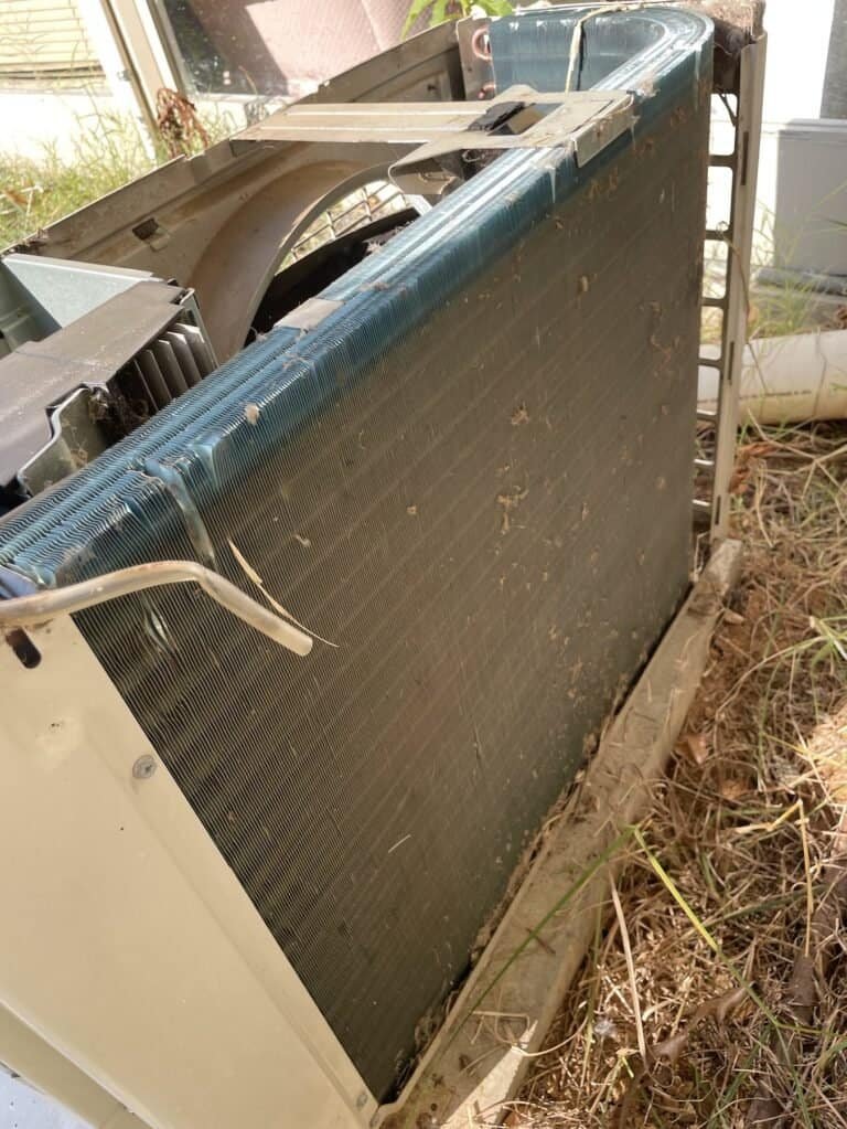 Outdoor AC unit cabinet opened up during a tune-up in Hackett, Arkansas