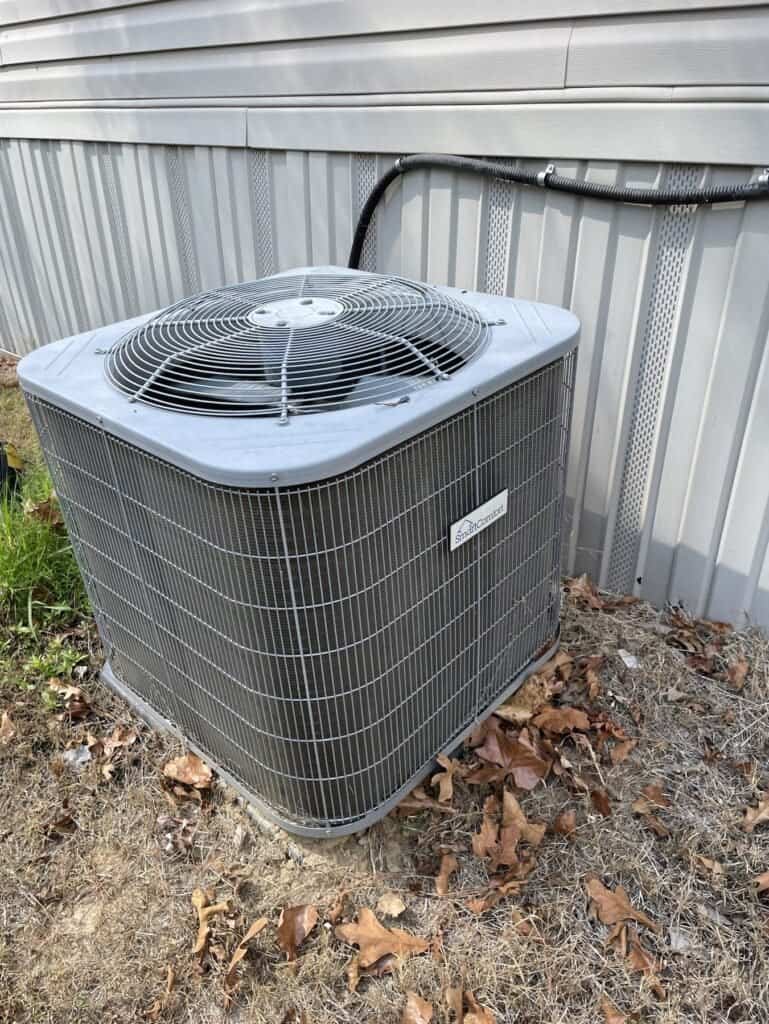 AC outdoor unit beside a home in Lavaca, Arkansas