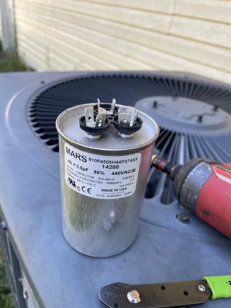 New run capacitor on top of an outdoor AC unit in Van Buren, Arkansas