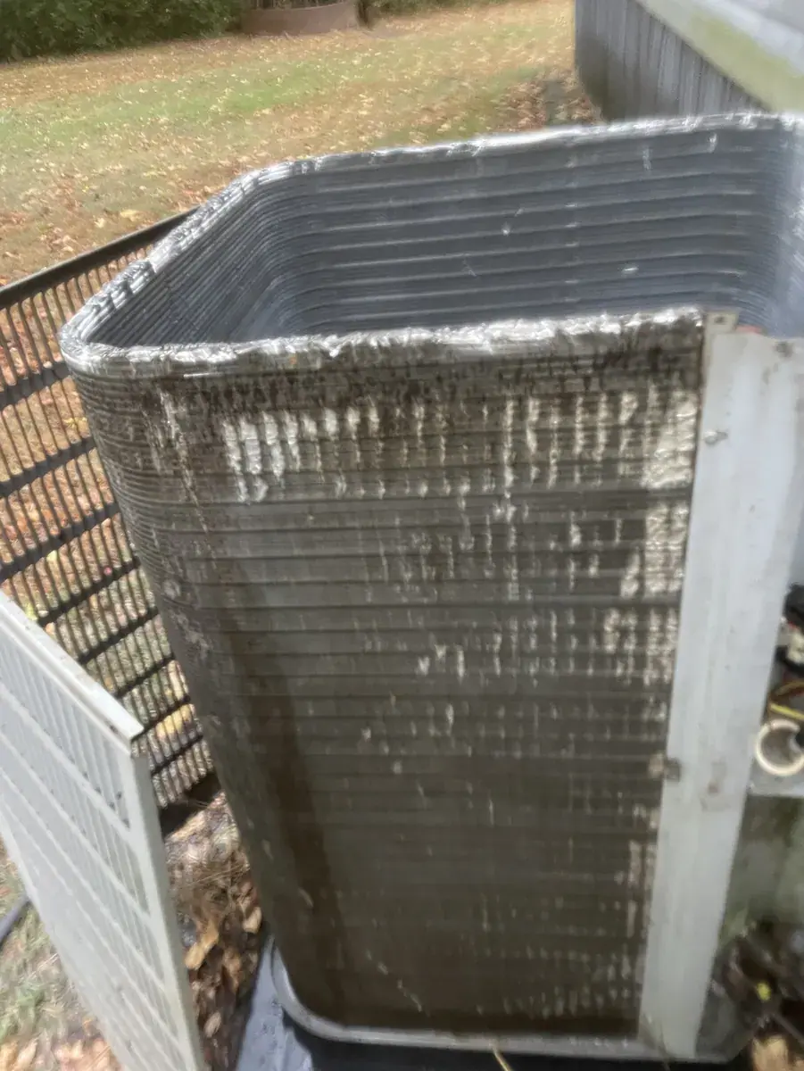 Outdoor coil of an Alma air conditioner with the top removed for inspection
