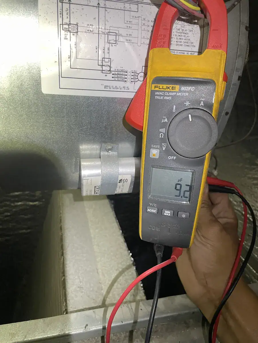 Meter checking how much power the indoor fan motor uses in an Alma home