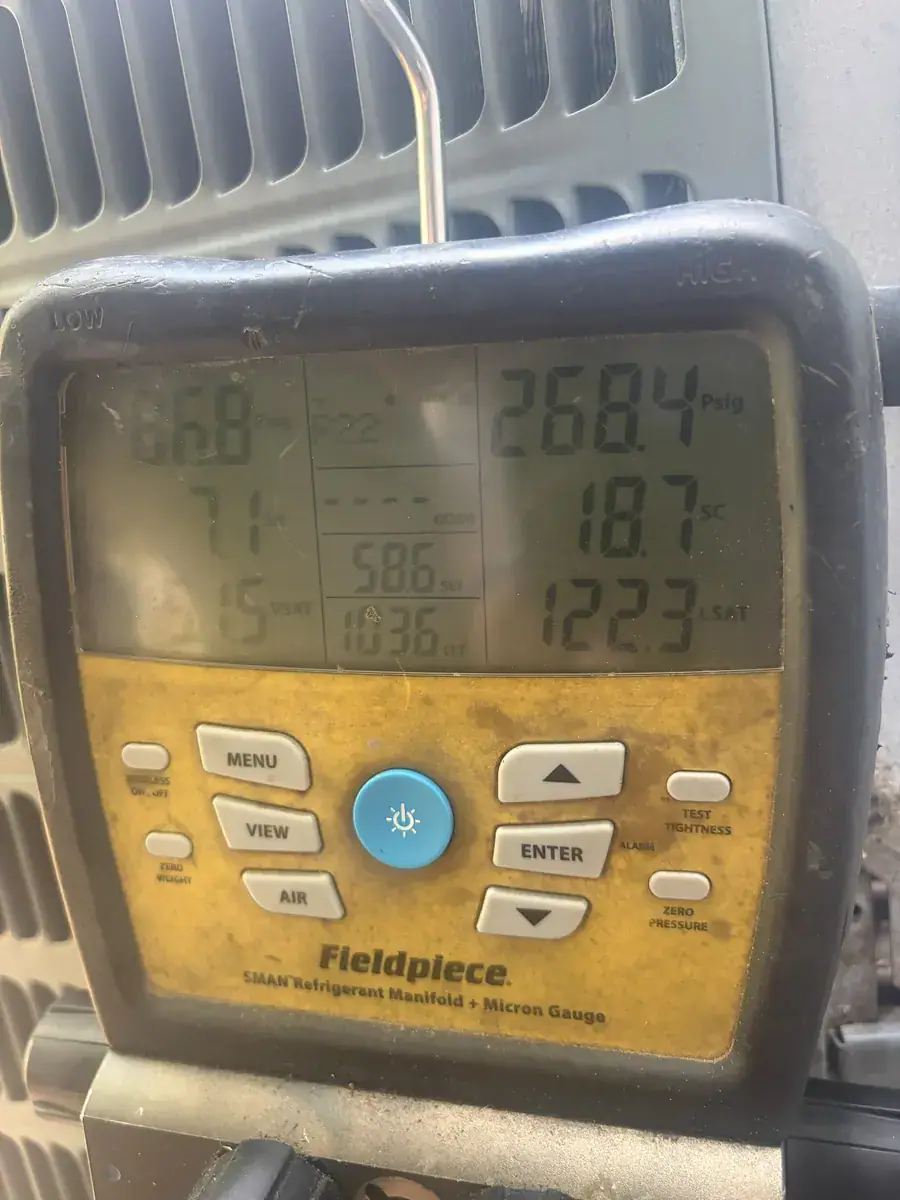 Pressure gauges on an Alma outdoor AC unit