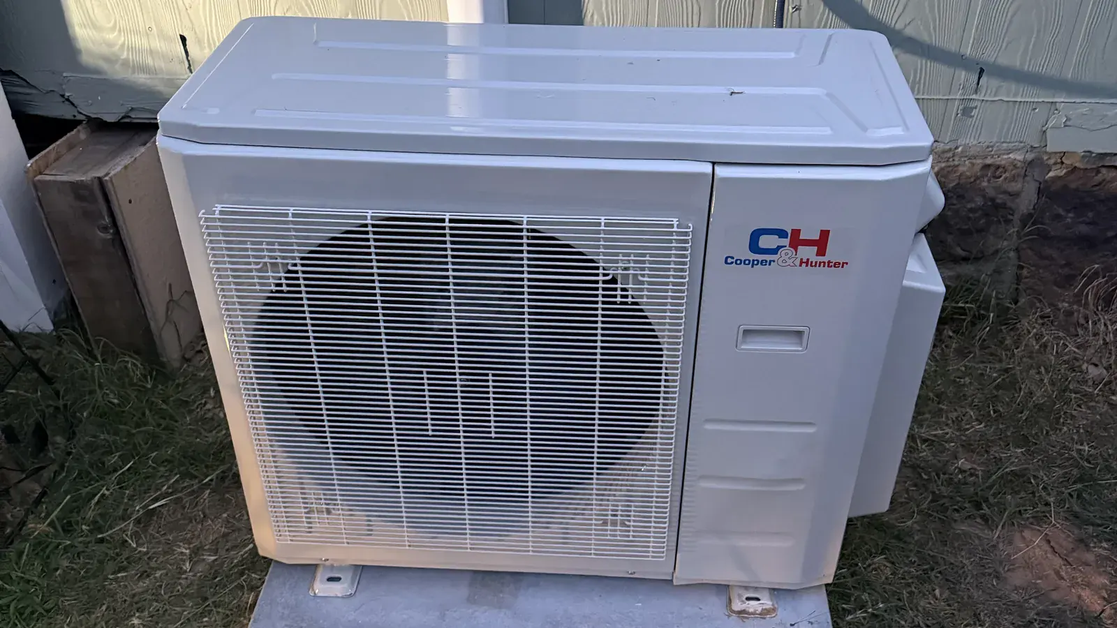 New ductless outdoor unit installed beside an Alma home