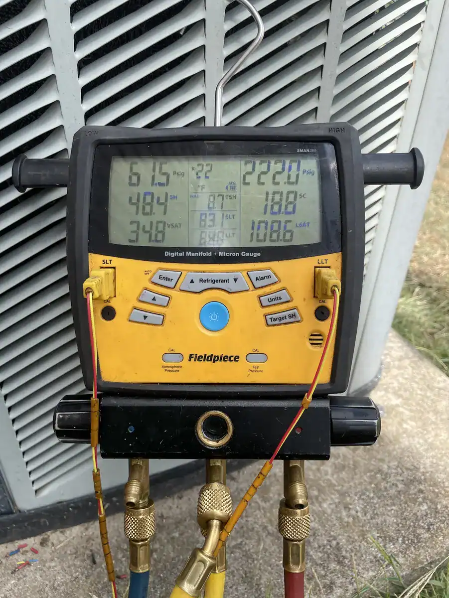 Pressure gauges hooked to a heat pump outdoor unit in Fort Smith