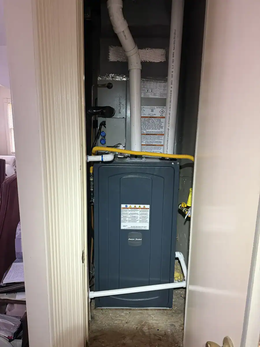 New furnace in a Fort Smith utility closet, with the cooling coil (the part that chills the air) on top