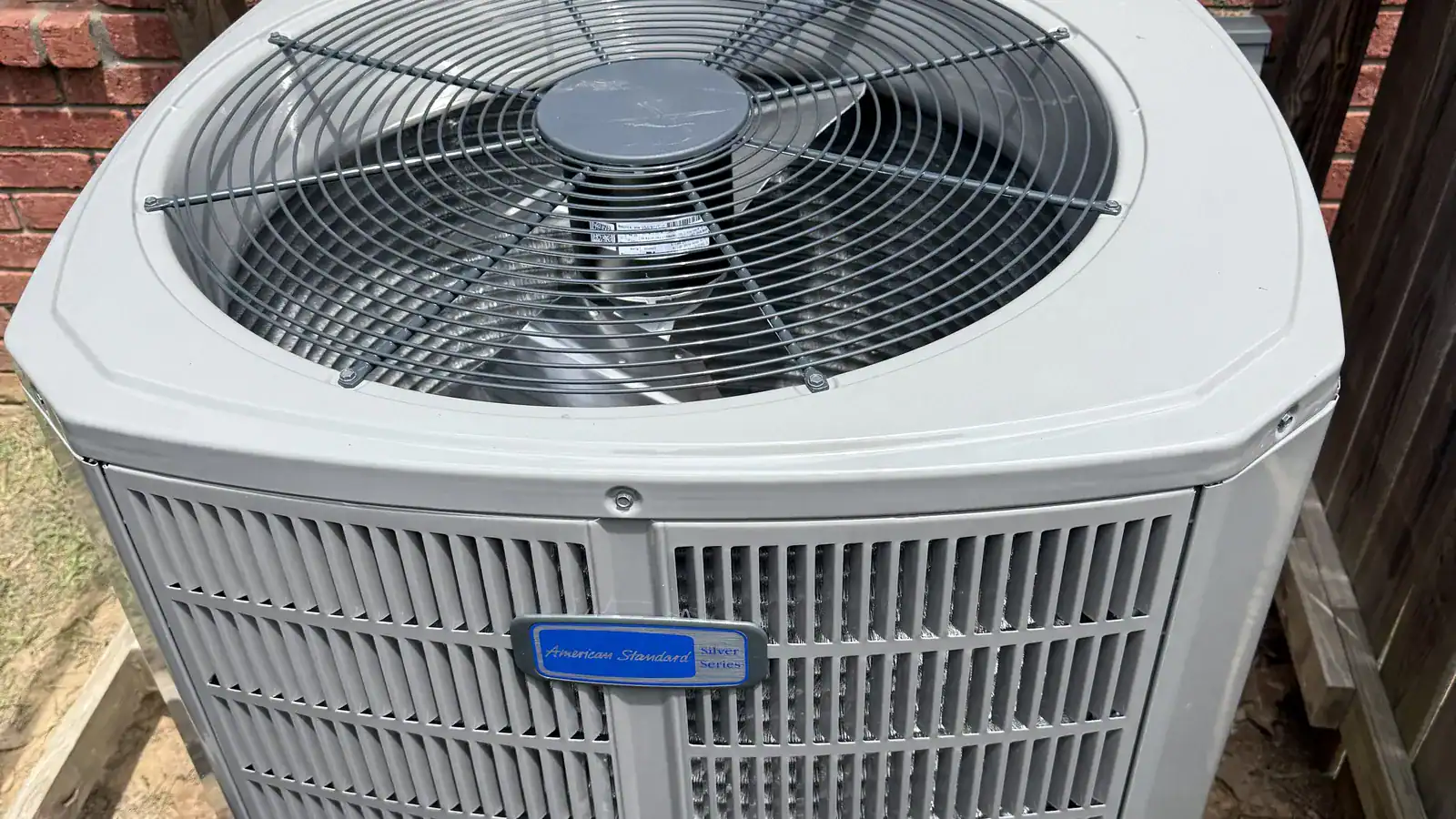 New American Standard outdoor AC unit installed at a Greenwood home