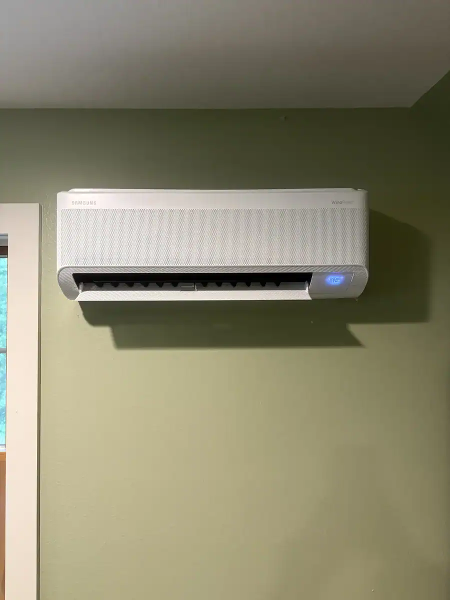 New ductless indoor unit mounted high on a wall in a Greenwood home