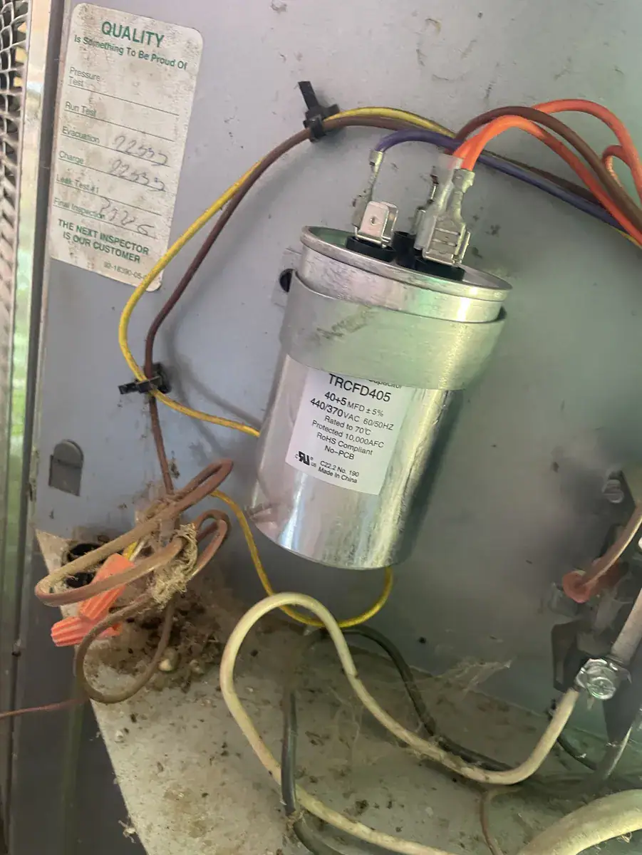 Capacitor (motor start part) and wiring inside a Van Buren outdoor AC unit
