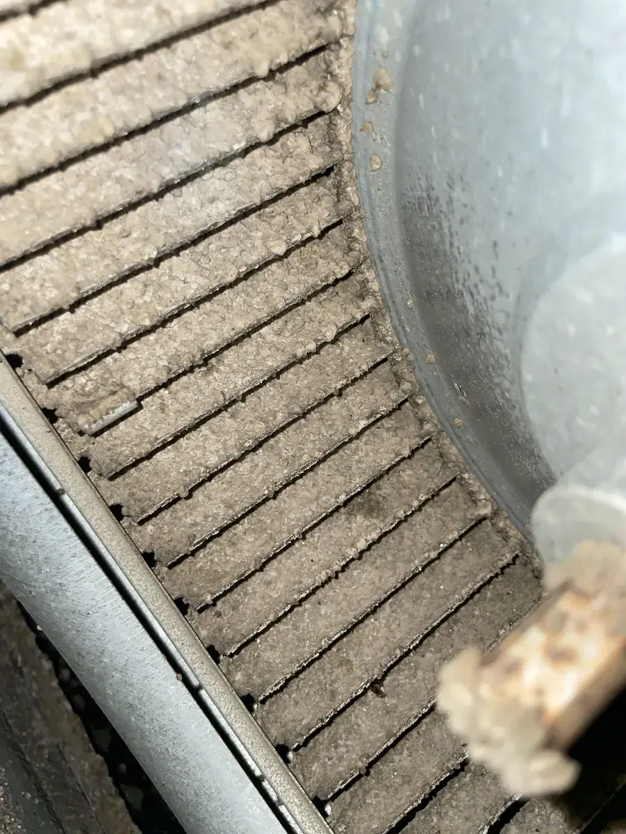 Dust built up on the indoor fan, found during a Van Buren AC repair