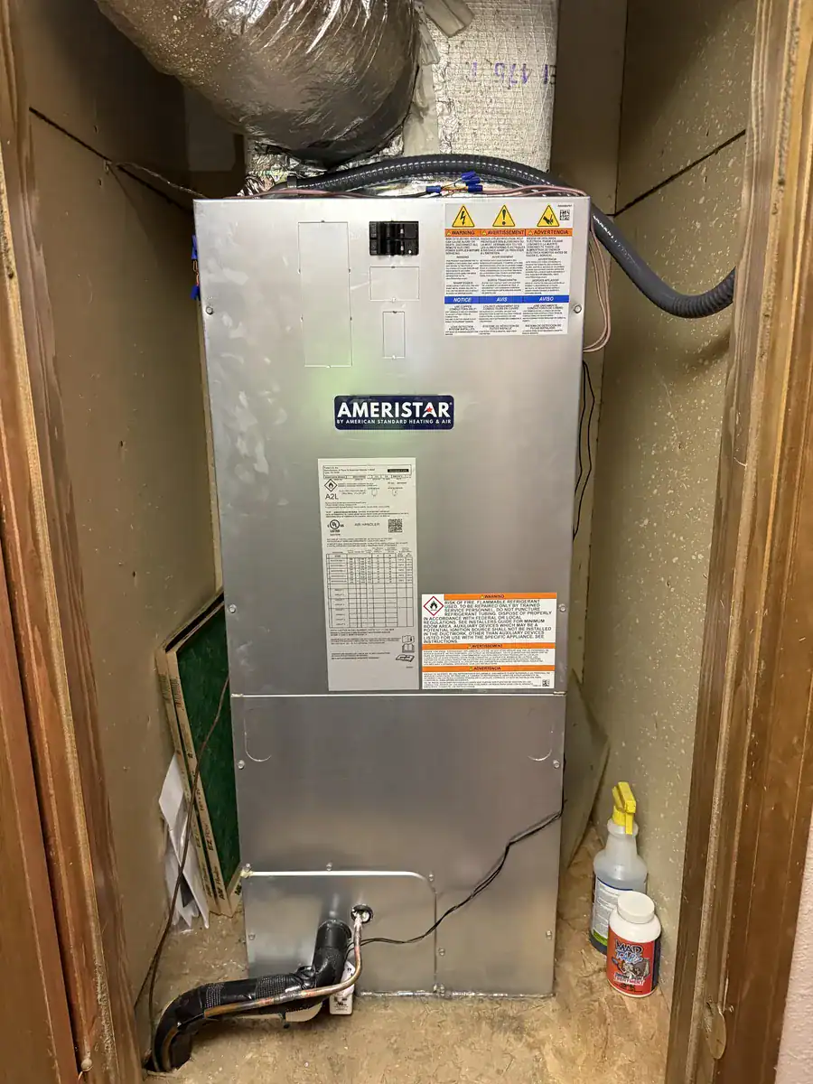 New indoor air handler (the indoor half of a heat pump system) standing in a Van Buren closet